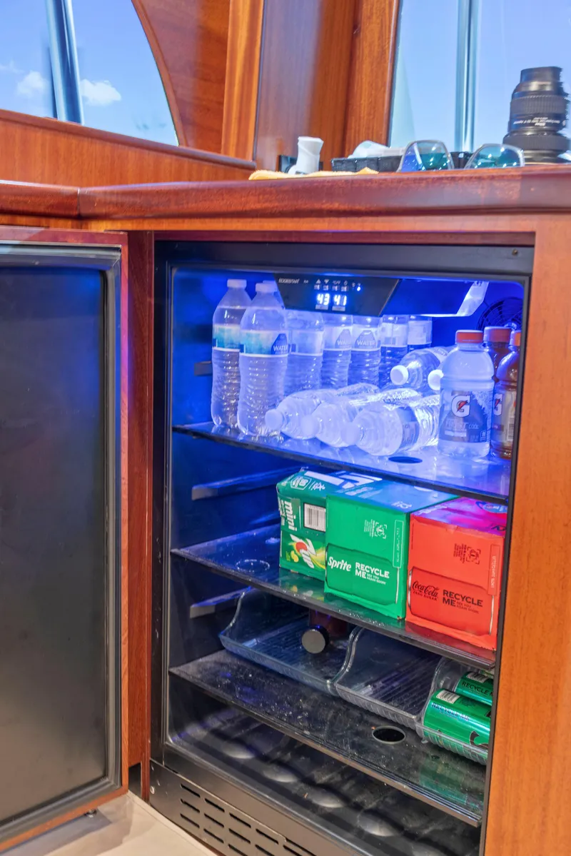 Slide: The Image of Mini fridge stocked with drinks on a 1963 Whiticar 54 Sportfisherman yacht. - 33