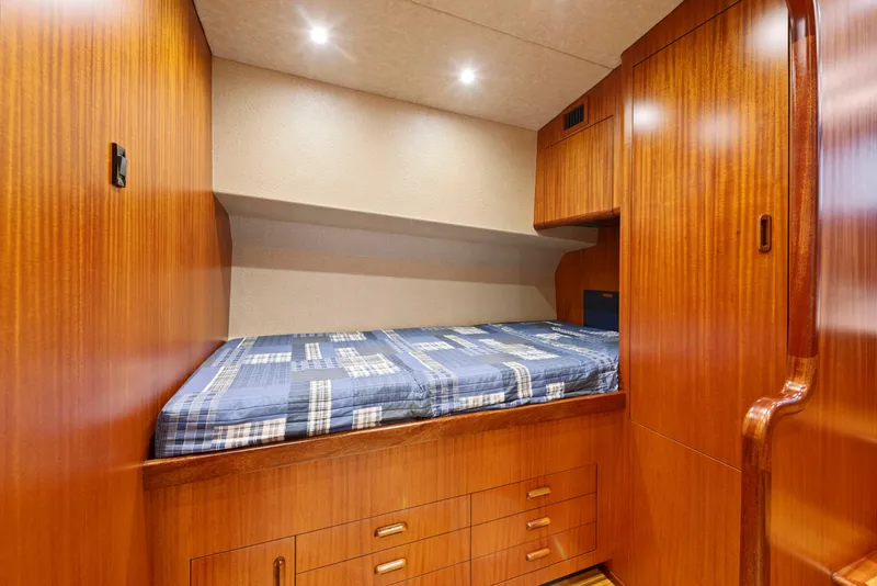 Slide: The Image of Cozy cabin interior of 1963 Whiticar 54 Sportfisherman with wood paneling and bed. - 39