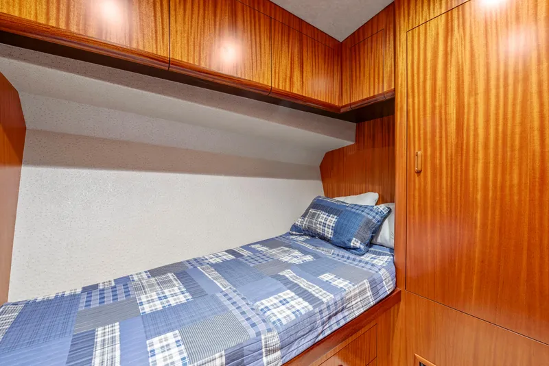 Slide: The Image of Cozy cabin interior of 1963 Whiticar 54 Sportfisherman with wooden finish and single bed. - 41