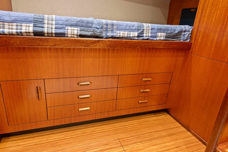 Slide: The Image of Wooden cabin interior of 1963 Whiticar 54 Sportfisherman with bed and storage drawers. - 42