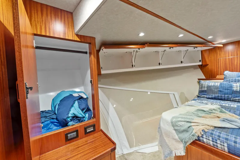 Slide: The Image of Cozy cabin interior of 1963 Whiticar 54 Sportfisherman with wood paneling and bedding. - 46