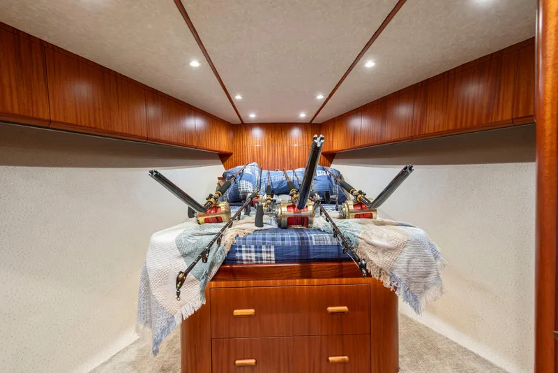 Slide: The Image of Interior of 1963 Whiticar 54 Sportfisherman with fishing rods and wooden cabinetry. - 49