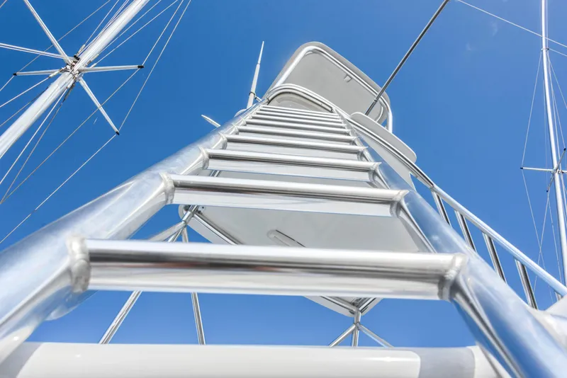 Slide: The Image of Ladder on 1963 Whiticar 54 Sportfisherman against clear blue sky. - 6