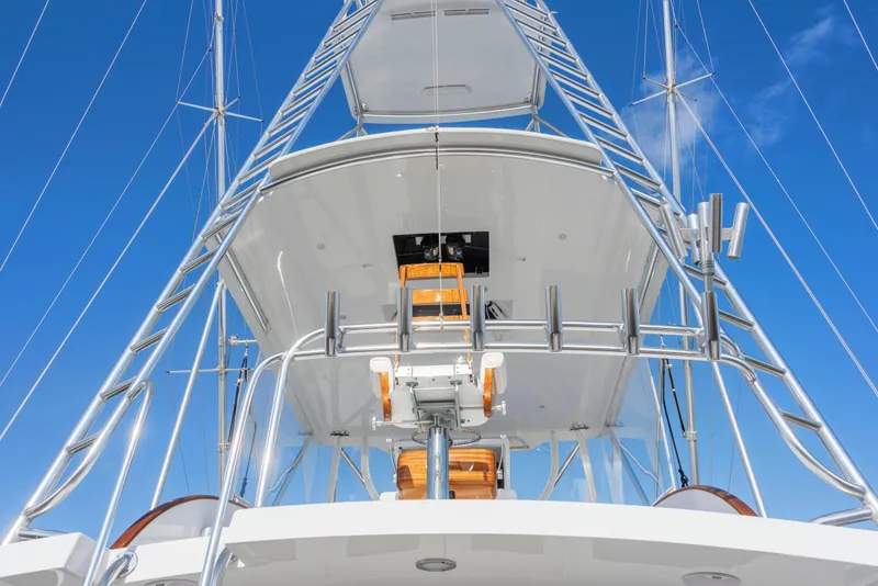 Slide: The Image of 1963 Whiticar 54 Sportfisherman boat tower against clear blue sky. - 7