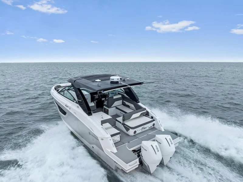 Slide: The Image of 2023 Cruisers Yachts 34 GLS Outboard cruising on open water. - 41