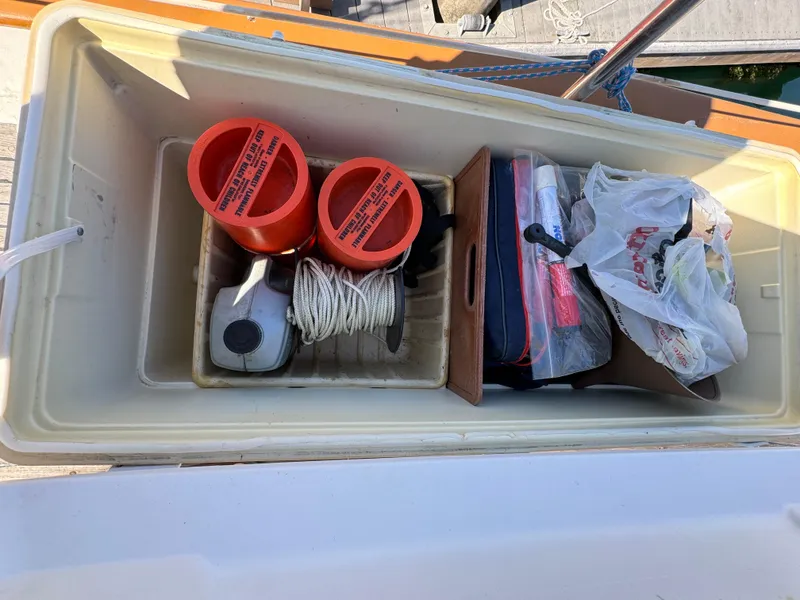 Slide: The Image of Storage compartment on 1984 Transpacific Marine Ketch with marine equipment and supplies. - 14