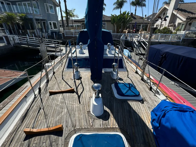 Slide: The Image of 1984 Transpacific Marine Ketch docked, showcasing deck and rigging details. - 20