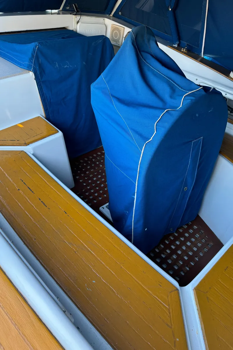 Slide: The Image of 1984 Transpacific Marine Ketch interior with blue covers and wooden flooring. - 38