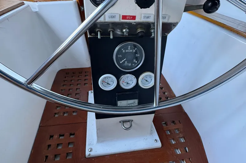 Slide: The Image of 1984 Transpacific Marine Ketch steering wheel and instrument panel close-up. - 41