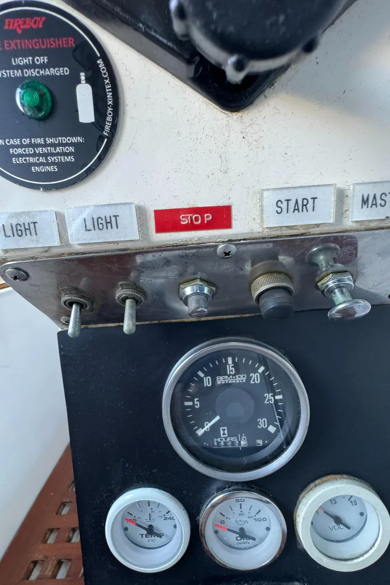 Slide: The Image of Control panel of a 1984 Transpacific Marine Ketch with gauges and switches. - 42