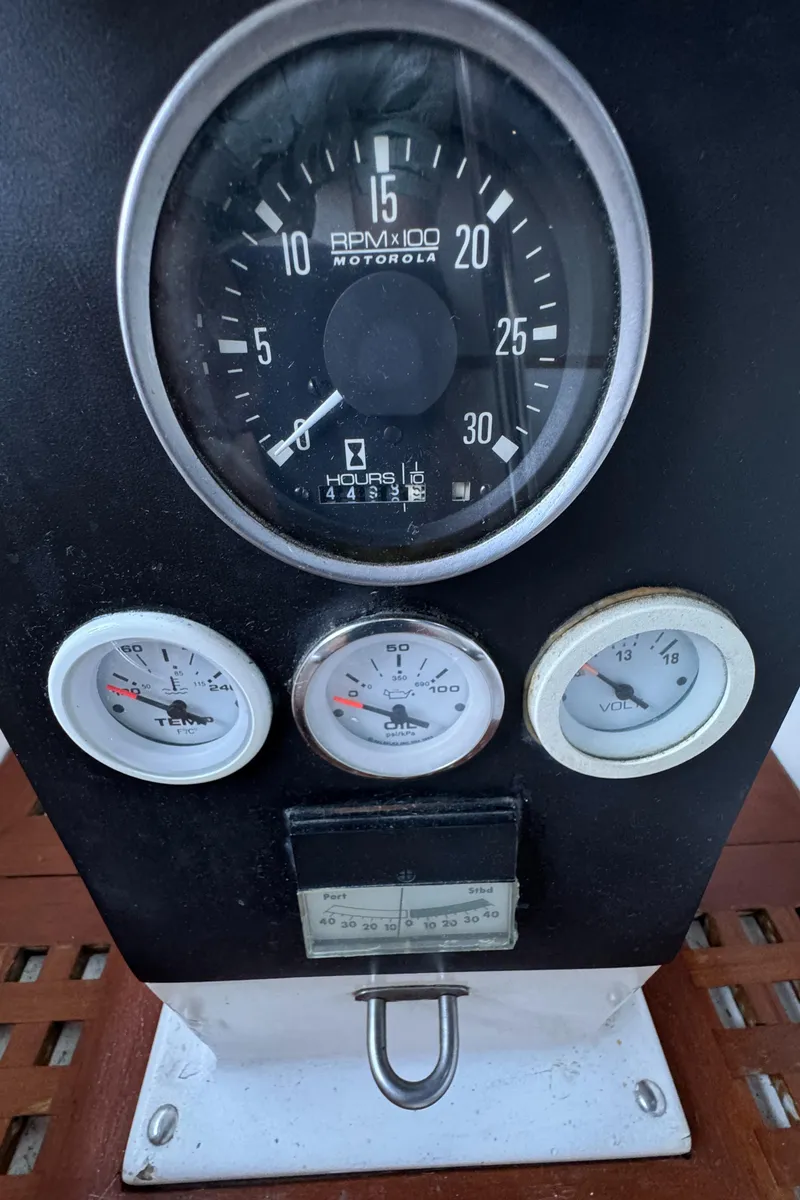 Slide: The Image of Close-up of 1984 Transpacific Marine Ketch dashboard gauges and dials. - 43