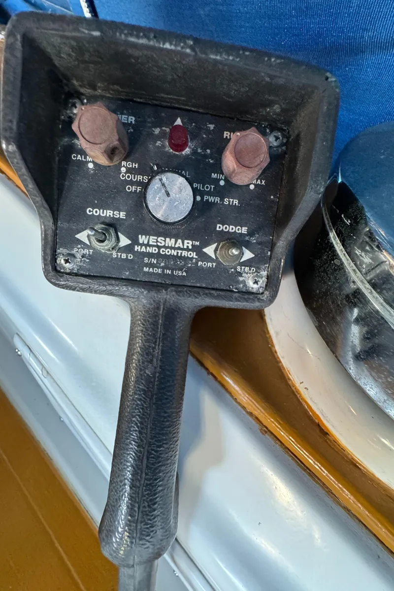 Slide: The Image of Wesmar hand control on 1984 Transpacific Marine Ketch, featuring course and dodge settings. - 46