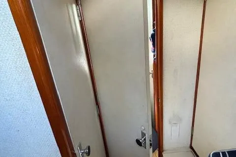 Slide: The Image of Interior view of a 1977 Bertram 35 Convertible boat cabin door. - 13