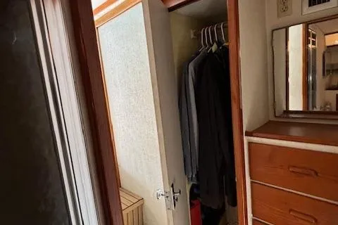 Slide: The Image of Interior of 1977 Bertram 35 Convertible with closet and dresser. - 16