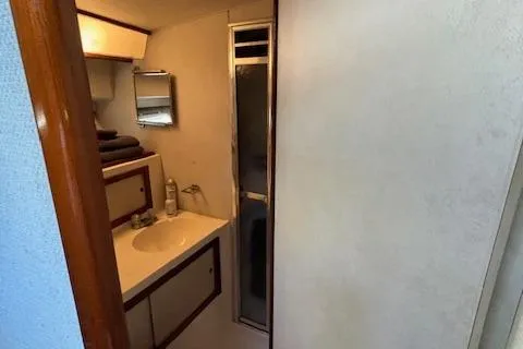 Slide: The Image of Bathroom interior of 1977 Bertram 35 Convertible yacht with sink and shower. - 17