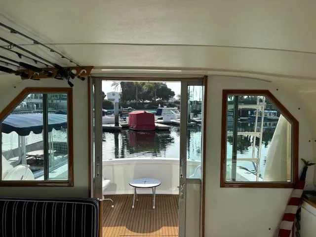 Slide: The Image of Interior view of 1977 Bertram 35 Convertible yacht overlooking marina. - 19