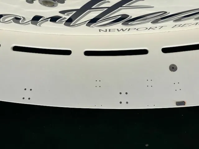 Slide: The Image of 1977 Bertram 35 Convertible boat stern with Newport Beach lettering. - 21