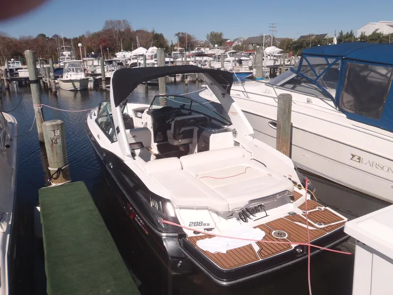 Slide: The Image of 2015 Monterey 288 Super Sport boat docked in a marina. - 10