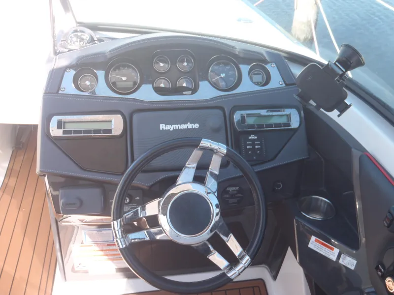 Slide: The Image of Dashboard of 2015 Monterey 288 Super Sport boat with Raymarine equipment. - 9