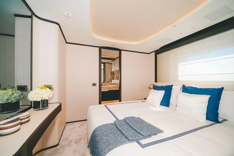 Slide: The Image of Luxurious bedroom interior on 2020 Benetti Delfino 95 yacht, featuring elegant decor and modern amenities. - 44