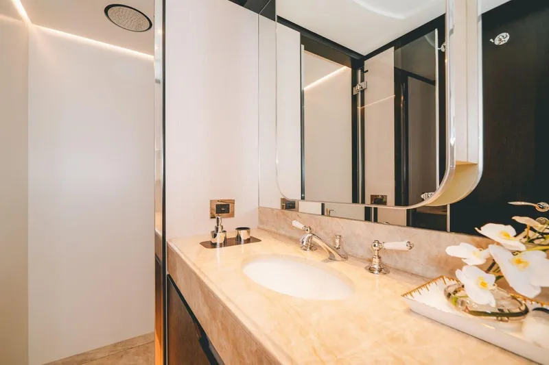 Slide: The Image of Luxurious bathroom in 2020 Benetti Delfino 95 yacht with elegant fixtures and floral decor. - 45