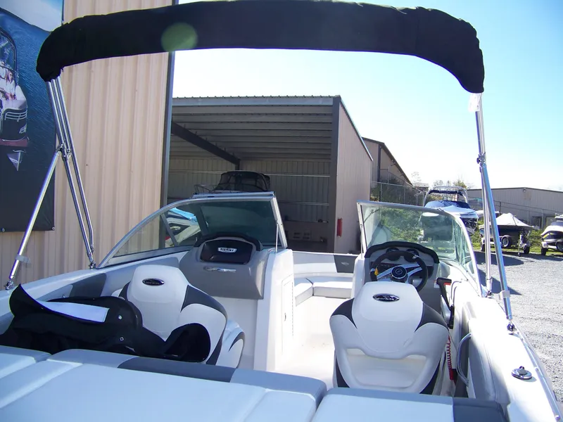 Slide: The Image of 2024 Chaparral 19 SSi OB boat interior with seating and steering wheel. - 3