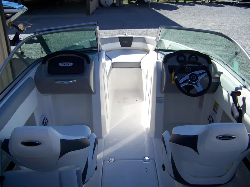 Slide: The Image of 2024 Chaparral 19 SSi OB boat interior with dual seats and steering console. - 4