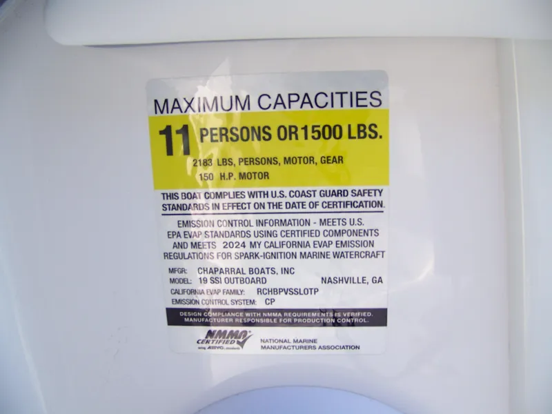 Slide: The Image of 2024 Chaparral 19 SSi OB capacity label: 11 persons or 1500 lbs, 150 HP motor. - 6
