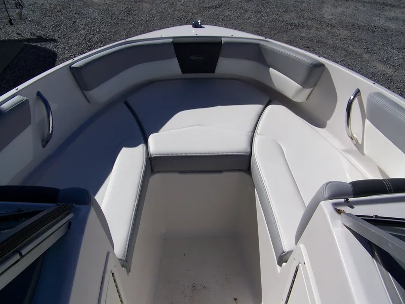 Slide: The Image of 2024 Chaparral 19 SSi OB boat interior with white cushioned seating. - 7