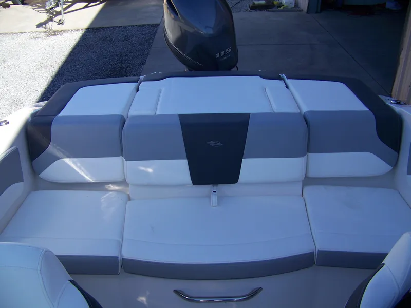 Slide: The Image of 2024 Chaparral 19 SSi OB boat interior with white and gray seating. - 8