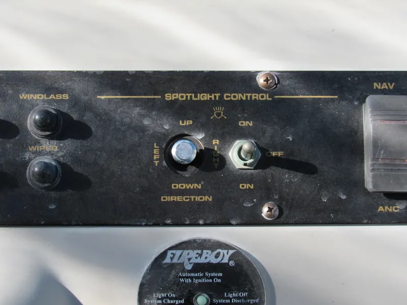 Slide: The Image of Control panel of 2003 Cruisers Yachts 2870 Express with spotlight and windlass switches. - 17