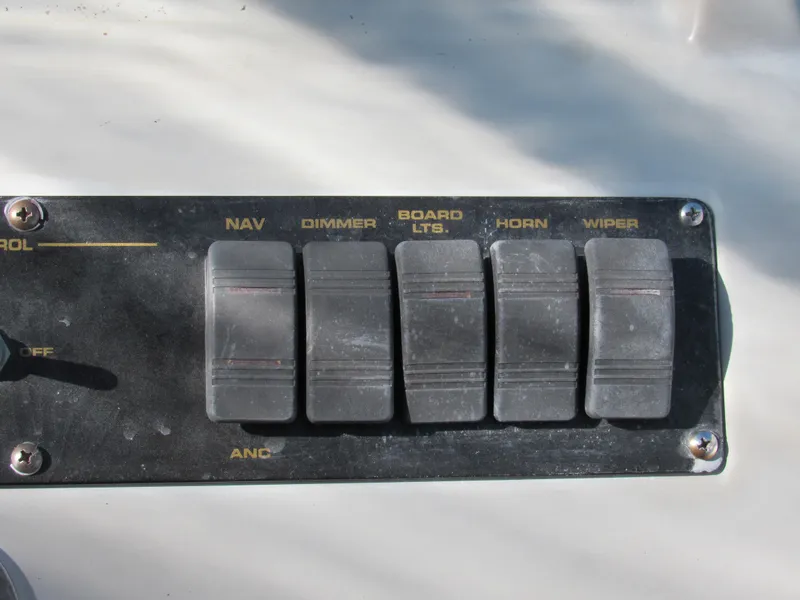 Slide: The Image of Control panel of 2003 Cruisers Yachts 2870 Express with labeled switches. - 18