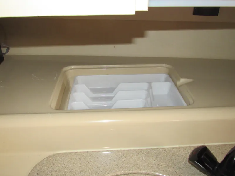 Slide: The Image of 2003 Cruisers Yachts 2870 Express interior with built-in countertop storage. - 42