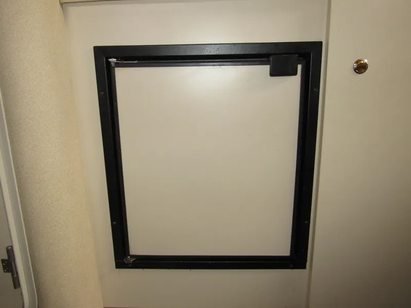 Slide: The Image of Cabin door of 2003 Cruisers Yachts 2870 Express, featuring a black frame. - 48