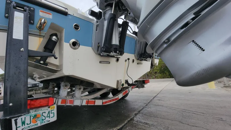 Slide: The Image of 2019 Mako 284 CC boat on trailer, rear view with Florida license plate. - 17