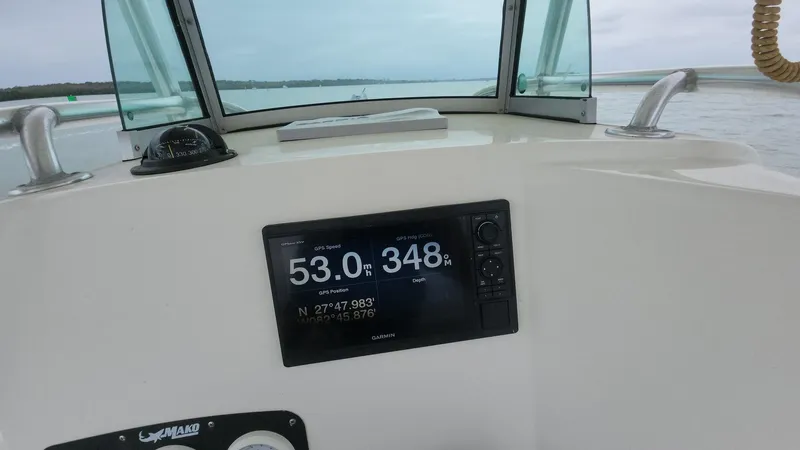 Slide: The Image of Dashboard of a 2019 Mako 284 CC boat showing navigation data on a digital display. - 3