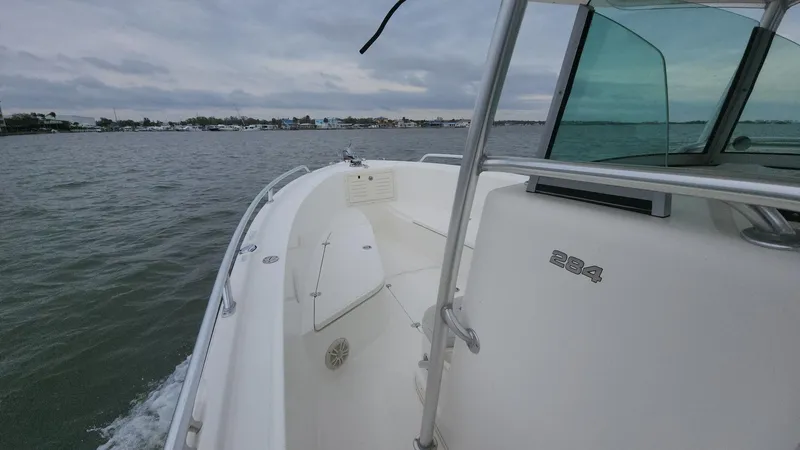 Slide: The Image of 2019 Mako 284 CC boat cruising on a cloudy day. - 37