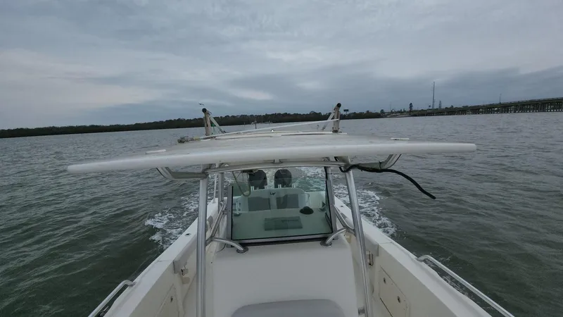 Slide: The Image of 2019 Mako 284 CC boat cruising on a cloudy day. - 41