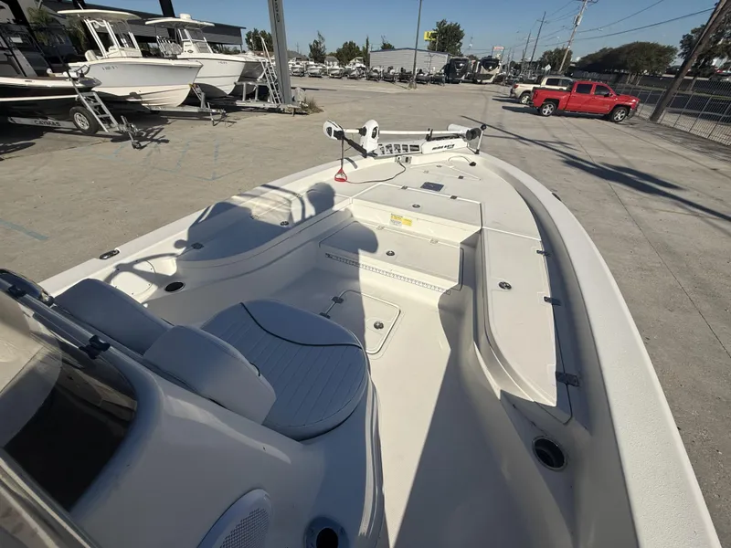 Slide: The Image of 2013 NauticStar 2200 T boat interior, featuring spacious seating and deck layout. - 14