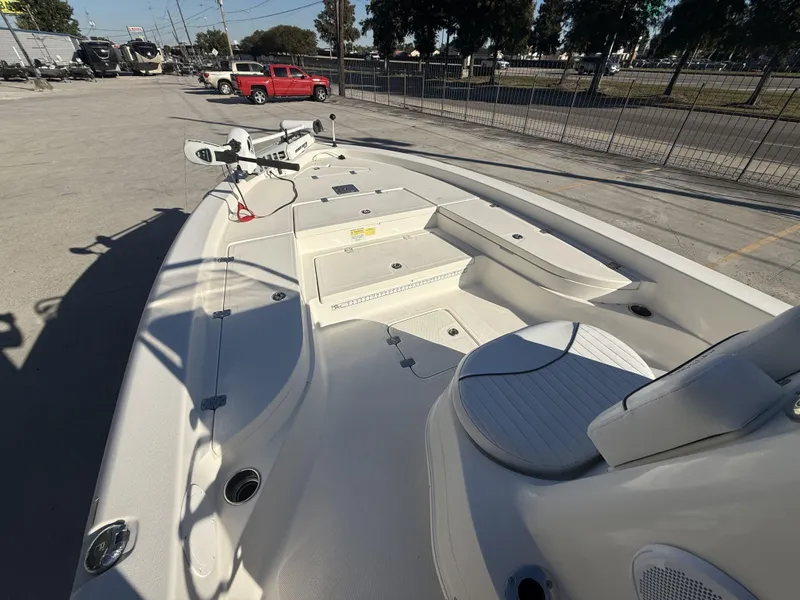 Slide: The Image of 2013 NauticStar 2200 T boat deck with seating and storage compartments. - 3