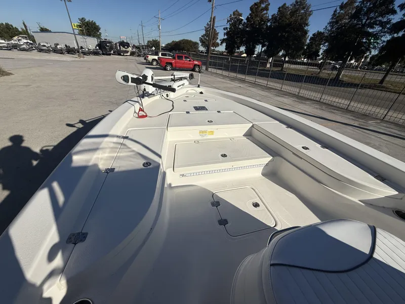 Slide: The Image of 2013 NauticStar 2200 T boat interior with storage compartments and seating. - 9