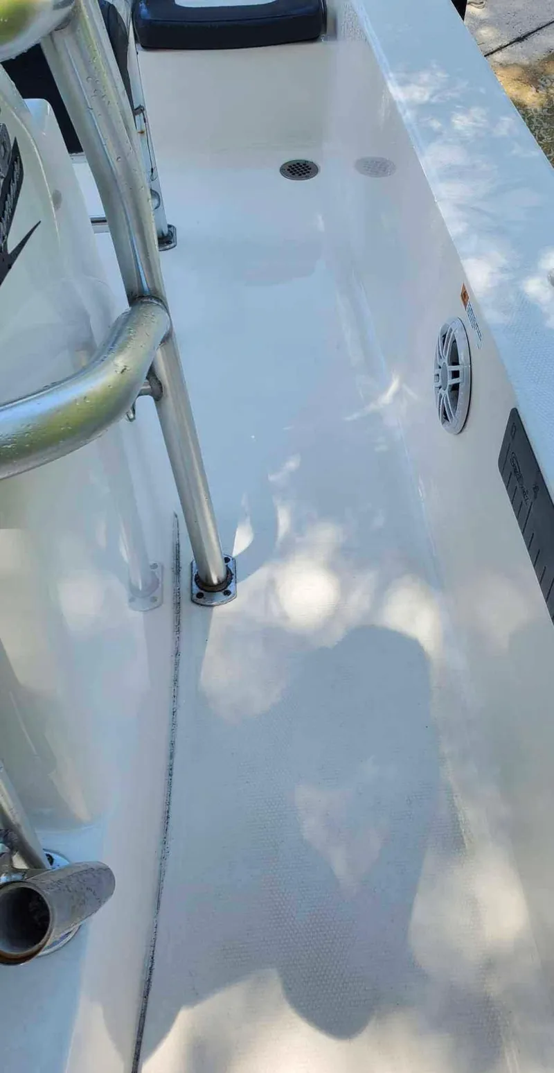 Slide: The Image of 2019 Robalo 206 Cayman boat deck with stainless steel railing. - 5