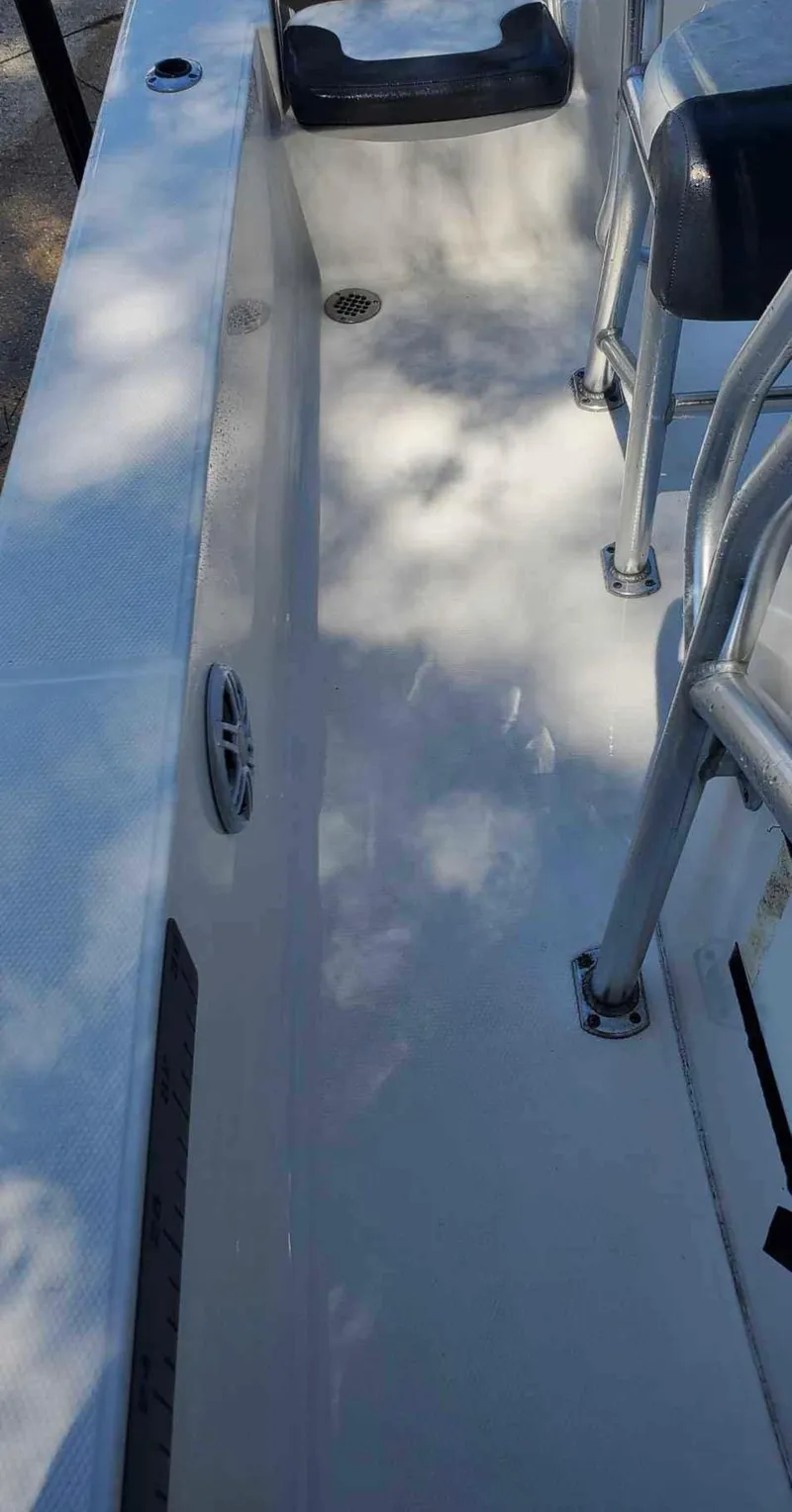 Slide: The Image of 2019 Robalo 206 Cayman boat interior with seating and railing. - 6