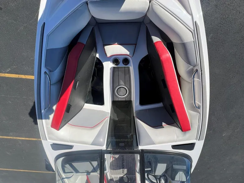 Slide: The Image of 2019 Moomba Mojo boat interior with red and gray seating, aerial view. - 18