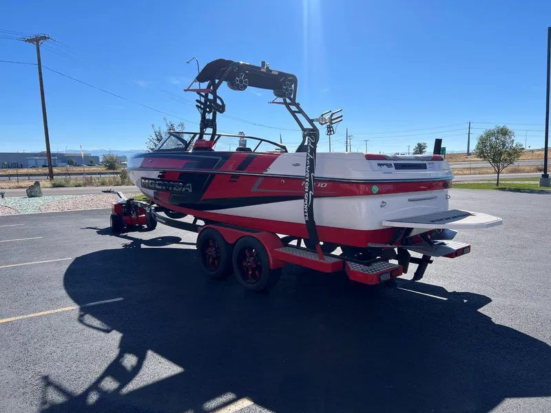 Slide: The Image of 2019 Moomba Mojo boat on trailer in sunny parking lot. - 8