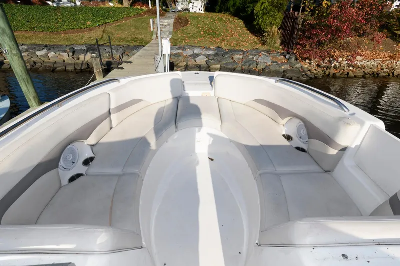 Slide: The Image of 2005 Chaparral Sunesta 274 boat interior with spacious seating and waterfront view. - 6