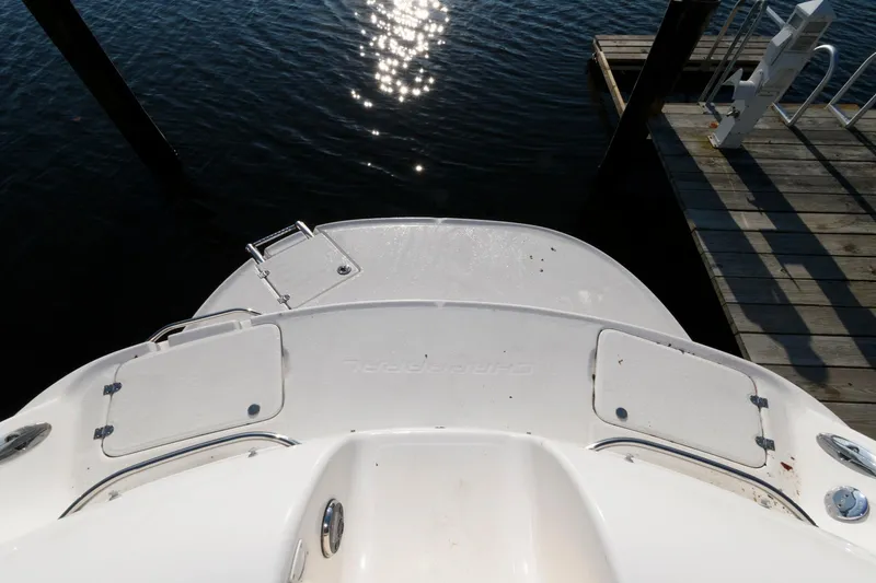 Slide: The Image of 2005 Chaparral Sunesta 274 boat stern view at dock with water reflections. - 9