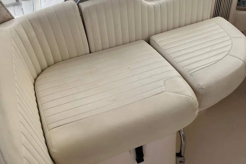 Slide: The Image of 2009 Grady-White Express 330 boat seating with white upholstery. - 10