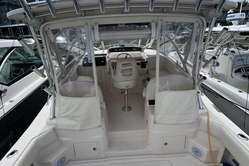 Slide: The Image of 2009 Grady-White Express 330 boat interior with helm and seating area. - 16