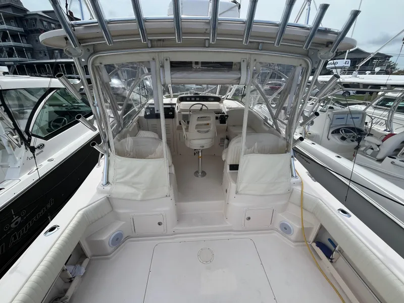 Slide: The Image of 2009 Grady-White Express 330 boat interior with helm and seating area. - 5